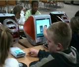 59.11 seconds, three educators in 3 different settings using computer technology with students and teachers