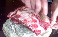 stone chip cutting meat from bone